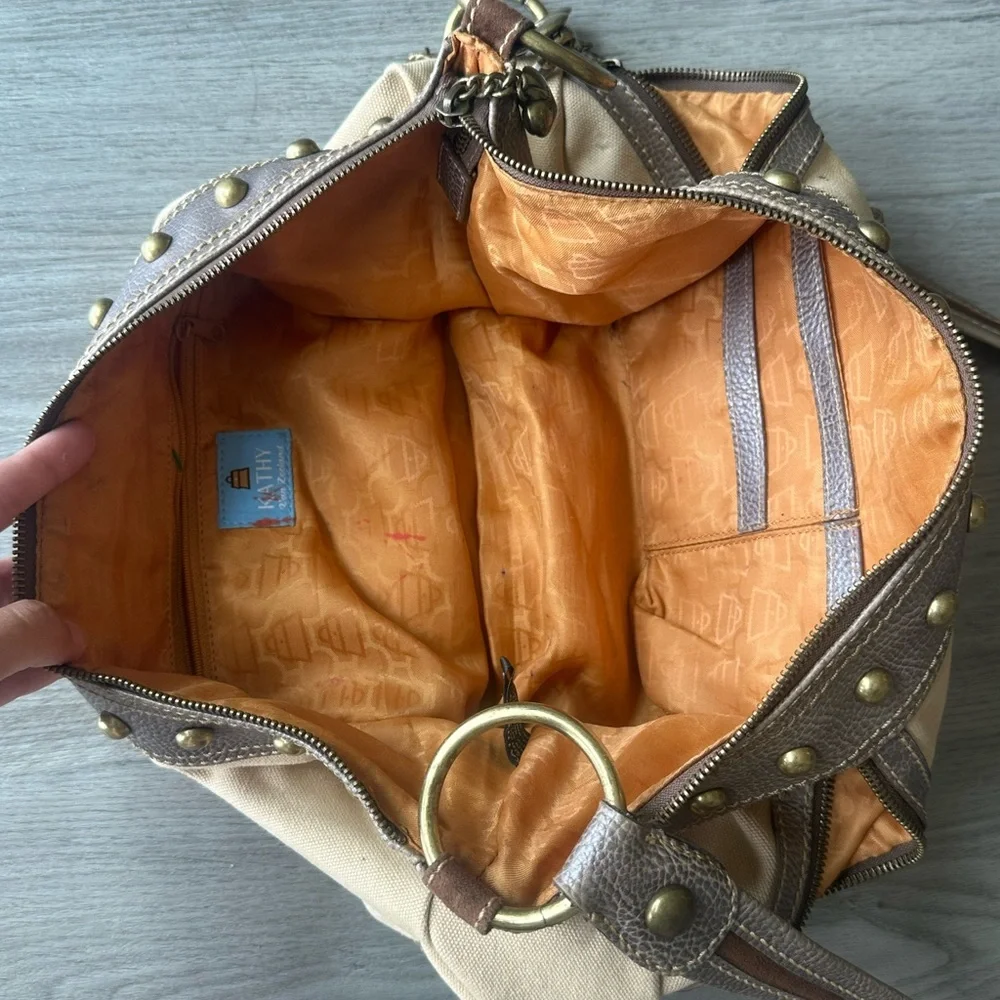 Kathy Van Zeeland brown and tan studded canvas + leather shoulder bag